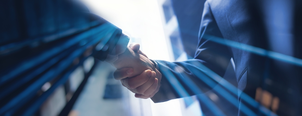 business handshake representing partnership and trust